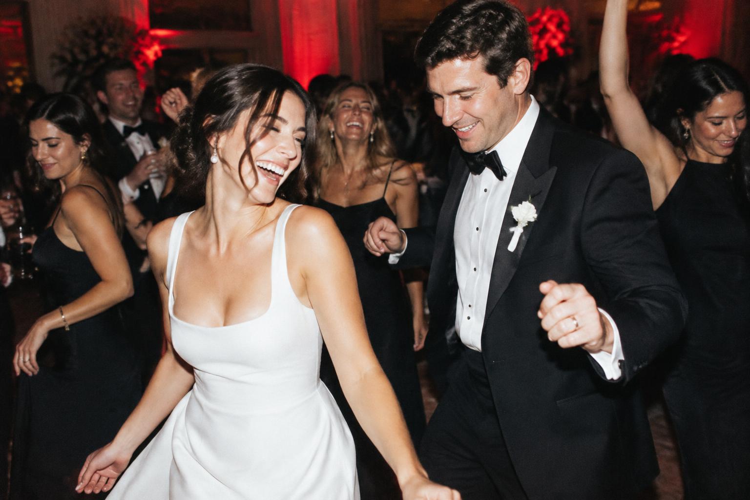 Guests sharing a joyful dance floor moment